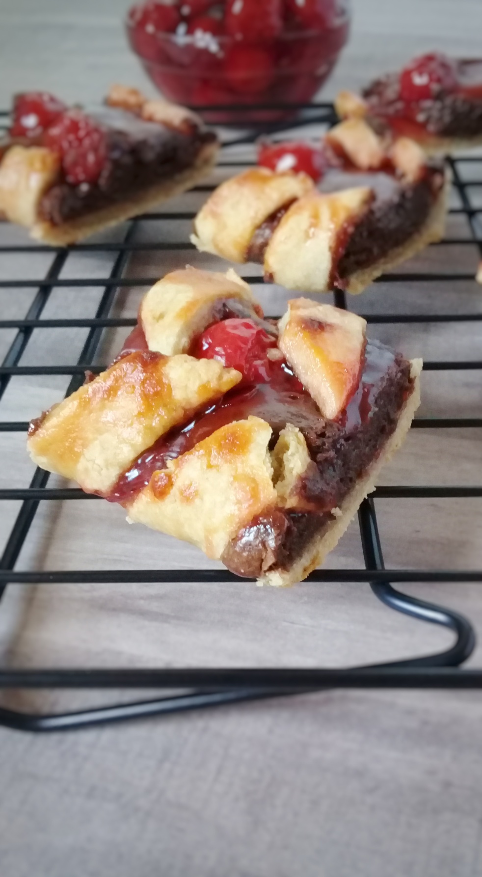 chocolate cheese cake filled pastry bites topped with cherry pie filling
